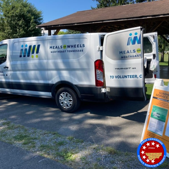FTHRA Meals on Wheels volunteers loading food for distribution